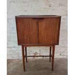 A mid 20th century teak cocktail cabinet, 123cm x 81cm x 41cm. IMPORTANT: Online viewing and bidding