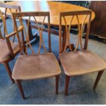 A G plan teak extending dining table together with a set of four dining chairs and two carvers.