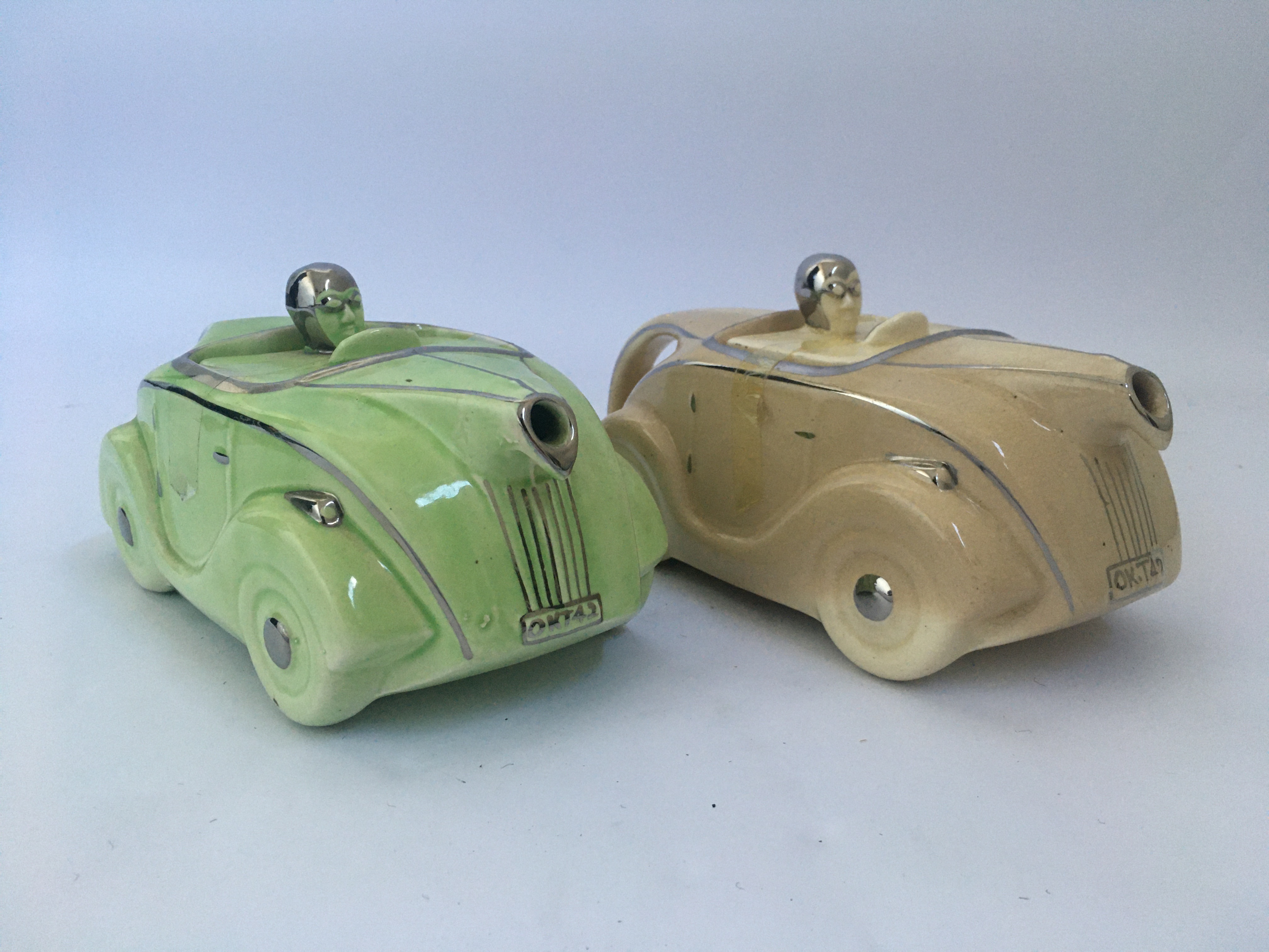 Two Sadler green and beige racing car teapots. IMPORTANT: Online viewing and bidding only.