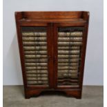 A quantity of 24 encyclopaedias inside an oak two lead glazed door cabinet. IMPORTANT: Online