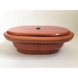 A red lacquerware lidded basin topped with small handle, approx. 18cm x 55cm. IMPORTANT: Online