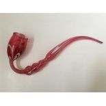 A Nailsea pink glass pipe with white twist design, approx. length 34cm. IMPORTANT: Online viewing