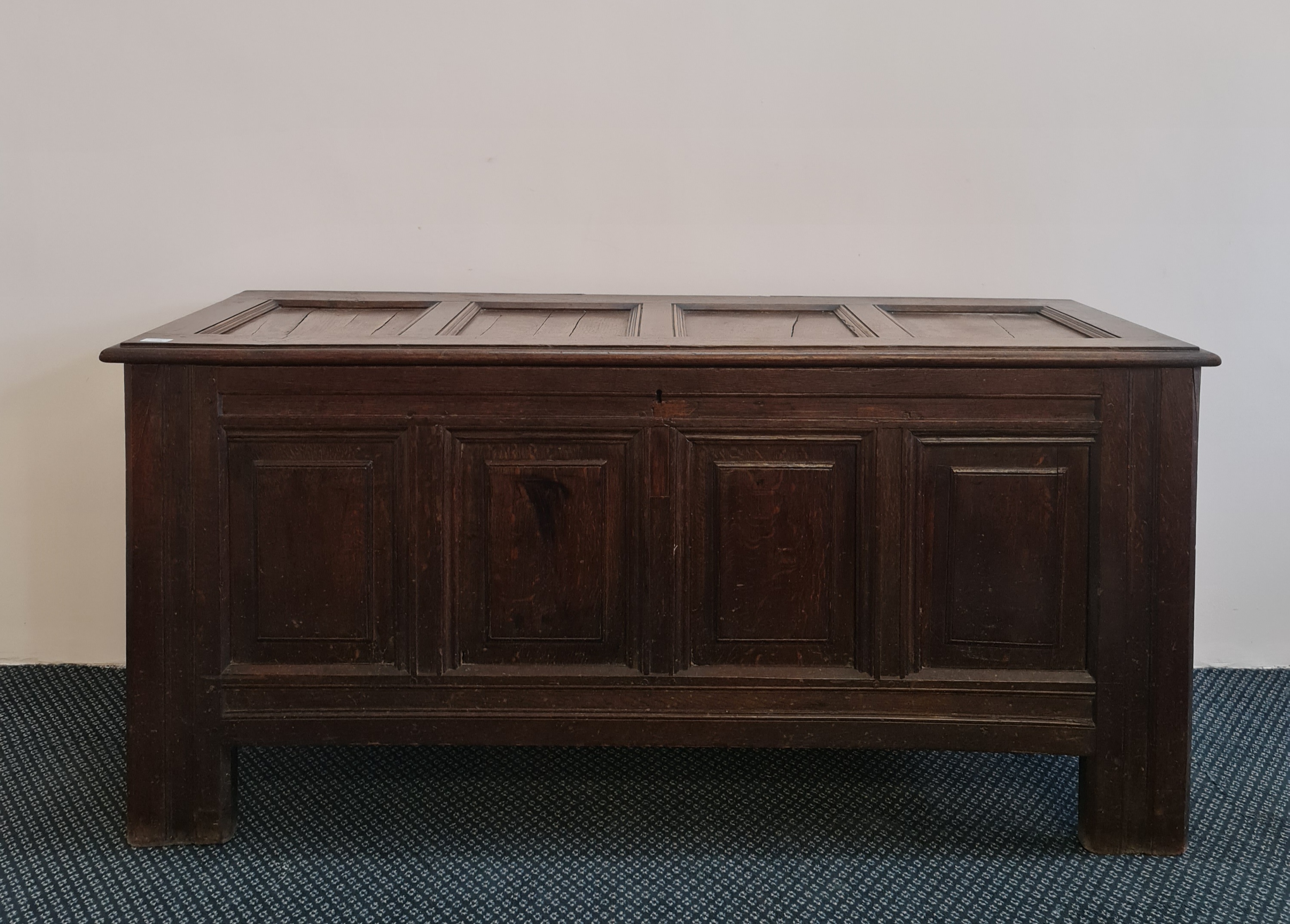 An 18th century oak four panel blanket box, 68cm x 146cm x 53cm. IMPORTANT: Online viewing and