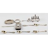 A collection of hallmarked silverware, to include a toast rack, an ash tray, a sifting spoon, a