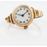 A hallmarked 9ct yellow gold cased ladies cocktail watch, the white enamel dial having hourly