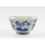 A Chinese Ming Dynasty Xuande (1426-1435) white bowl with blue hand painted floral motif scenes to