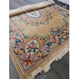 A large oriental rug with blue background and yellow border. IMPORTANT: Online viewing and bidding