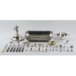 A collection of silver plate to include half of an entree dish, sugar sifting spoon, sugar tongs,