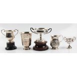 A collection of hallmarked silverware, to include a christening mug and two trophies, together