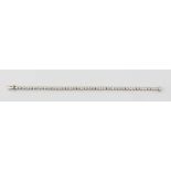 A hallmarked 18ct white gold diamond tennis bracelet, set with 40 round brilliant diamonds each in