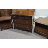 A Stag Minstrel bedroom suite comprising a five drawer chest, dressing table, stool and two