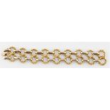 An 18ct yellow gold 1970s bracelet, featuring looped textured links connected by belcher links,