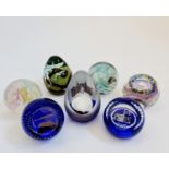 Three limited edition Caithness paperweights together with one Isle of Wight paperweight and two