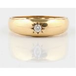 A hallmarked 9ct yellow gold diamond single stone ring, set with a round brilliant cut diamond,