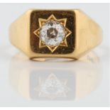 A hallmarked 18ct yellow gold diamond single stone ring, star set with a central old cut diamond,