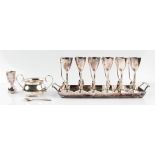 A collection of silver plated items, to include a pair of candelabras (A/F), a set of six egg cups