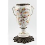 A 19th century French ice bucket with bronze base and rim and porcelain body, hand painted floral