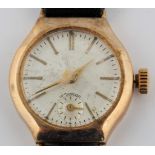 A hallmarked 9ct yellow gold cased ladies wrist watch, on a black strap. BOOK A VIEWING TIME SLOT ON