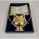 A hallmarked sterling silver with gold coloured motif 'Royal Loving Cup' to mark the marriage of HRH