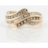 A diamond ring, the waved panel design set with round brilliant cut diamonds and baguette and