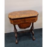 A Victorian walnut lift-top sewing table