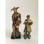 Set of two Royal Doulton characters, The Jester and The Laird, tallest height approx. 27cm.