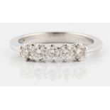 A five stone diamond ring, set with five round brilliant cut diamonds, total diamond weight