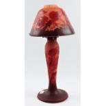 A reproduction Galle cameo glass lamp with poppy flowers design on red background, approx height