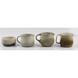 Three Molly Finlayson studio pottery jugs, together with a bowl with green and cream glazing. BOOK A