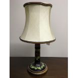 A Moorcroft table lamp base with floral green, pink, and purple pattern. IMPORTANT: Online viewing