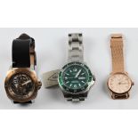 *Three FOSSIL wristwatches, two on metal bracelet straps, one on a leather strap. BOOK A VIEWING