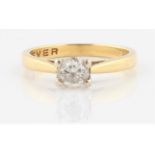 A hallmarked 18ct yellow gold diamond solitaire ring, set with a round brilliant cut diamond