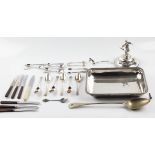 A collection of silver plate to include half of an entree dish, sugar sifting spoon, sugar tongs,