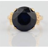 A hallmarked 9ct yellow gold blue paste dress ring, ring size U, approx. weight 8g. BOOK A VIEWING