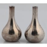 A pair of Jens Quistgaard for Dansk Designs weighted taper stick or candle holders, marked DANSK.