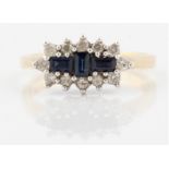 A hallmarked 9ct yellow gold sapphire and diamond ring, set with three baguette cut sapphires,