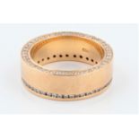 A diamond set wedding band, channel set with round brilliant cut diamonds to top of band and