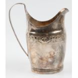A Georgian jug, engraved with foliage design and monogrammed cartouche to front, hallmark rubbed,