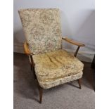 An Ercol armchair with upholstered seat and back. BOOK A VIEWING TIME SLOT ON OUR WEBSITE FOR THIS