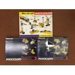 Two Meccano 2 sets, together with one Meccano 3 set.