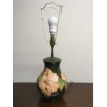 A Moorcroft green with pink flowers table lamp base. IMPORTANT: Online viewing and bidding only.