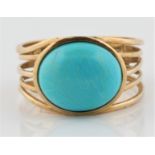 A hallmarked 9ct yellow gold reconstituted turquoise dress ring, with open metalwork design