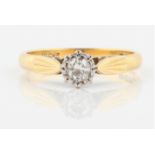 A diamond solitaire ring, illusion set with a round brilliant cut diamond, measuring approx. 0.20ct,