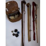 A selection of fly fishing equipment, to include three rods, one Hardy’s, a wicker creel basket