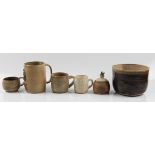 Four Molly Finlayson studio pottery mugs, together with two pots, all with brown glazing. BOOK A