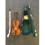 A violin with a bow in a case, approx length 66cm.