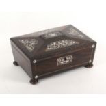 A mid Victorian rosewood and cut mother of pearl sewing box of sarcophagal form, attractively