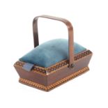 A rosewood Tunbridge ware pannier form pin cushion, the canted sides with geometric mosaic border,