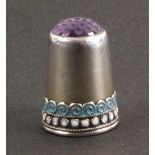 A Norwegian silver and enamel thimble, the frieze with blue enamel waves over snowballs, amethyst