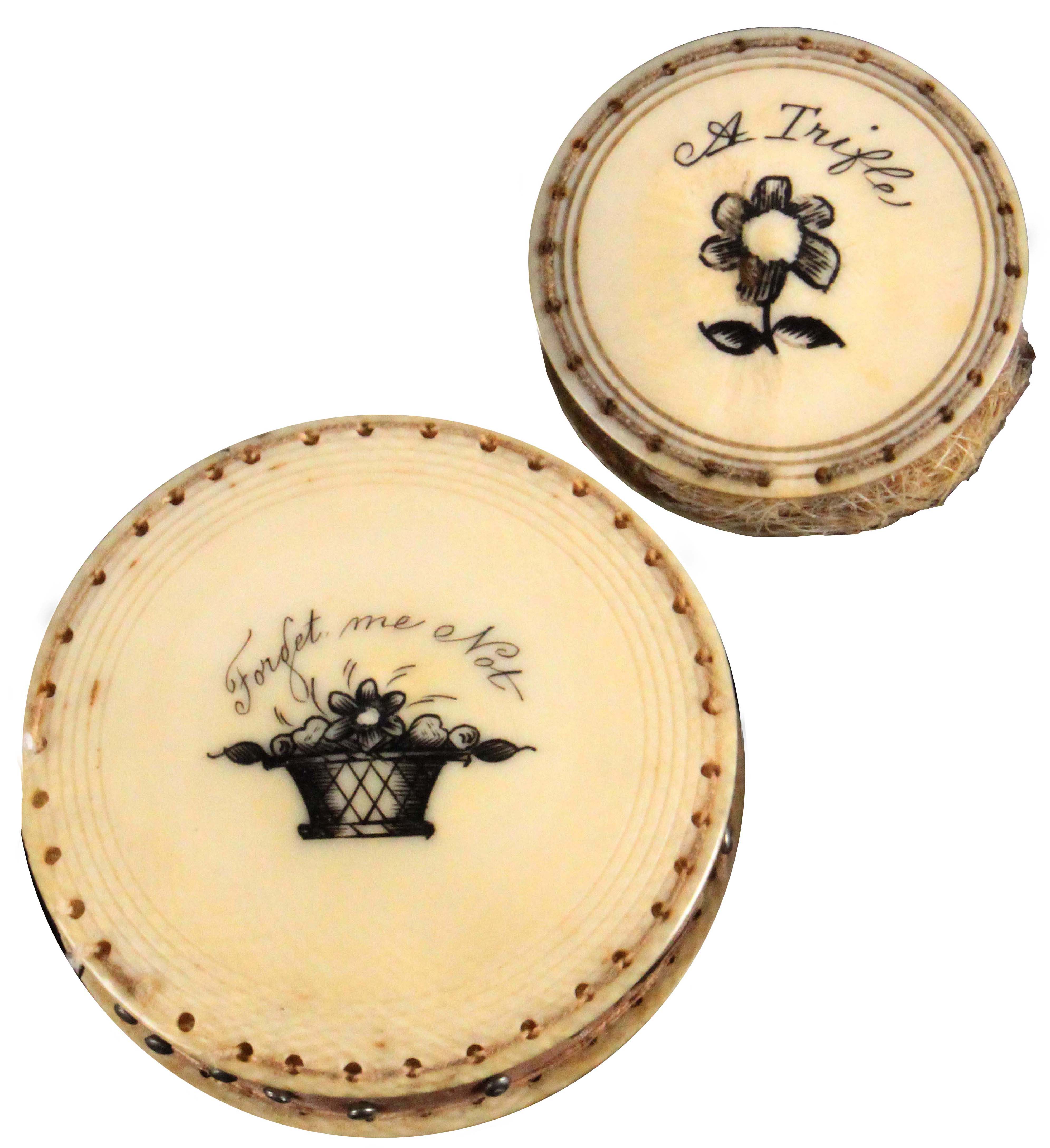 Two early 19th Century ivory disc form pin cushions, comprising an example engraved to one side with